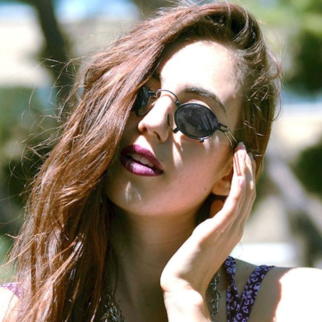 Long-haired trendy girl wearing STEAMPUNK inspired sunglasses from Giant Vintage