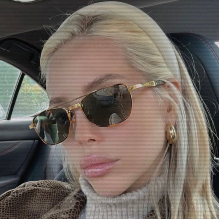 woman in a car wearing zing aviator sunglasses