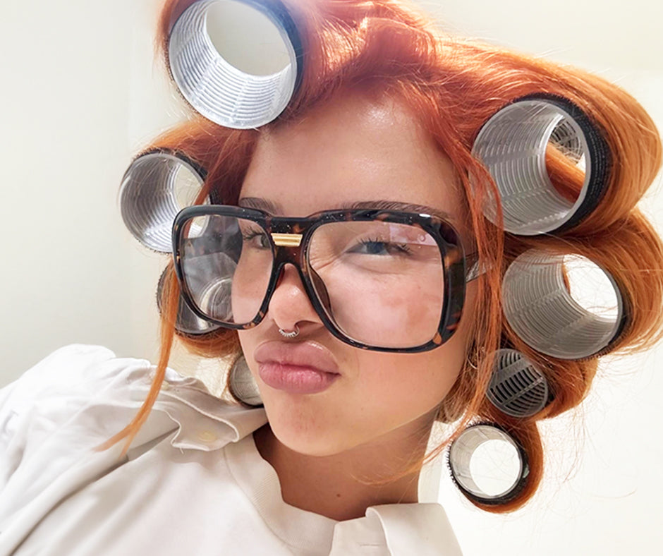 Woman in clear HIPSTER Oversized Clear Glasses promoting our sale for 40% off