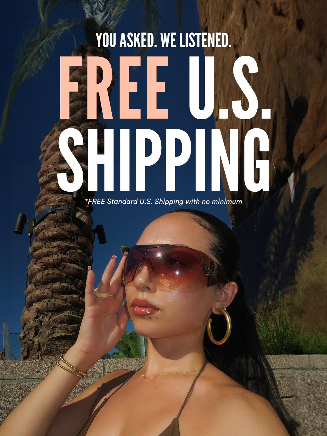 Free Standard U.S. Shipping with no minimum! Woman with Shield sunglasses at the beach.