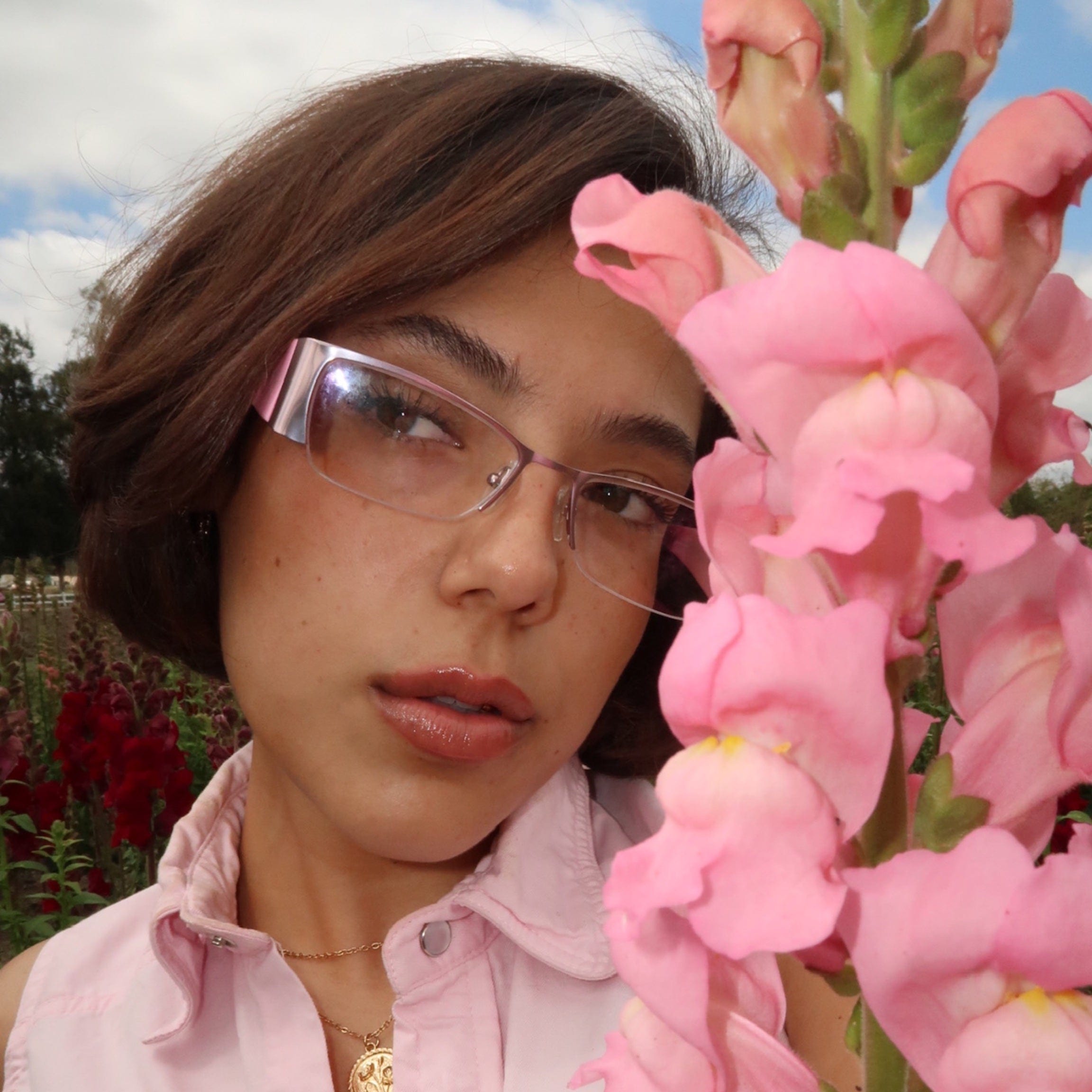 Model wearing meow Pink/Clear semi-rimless glasses