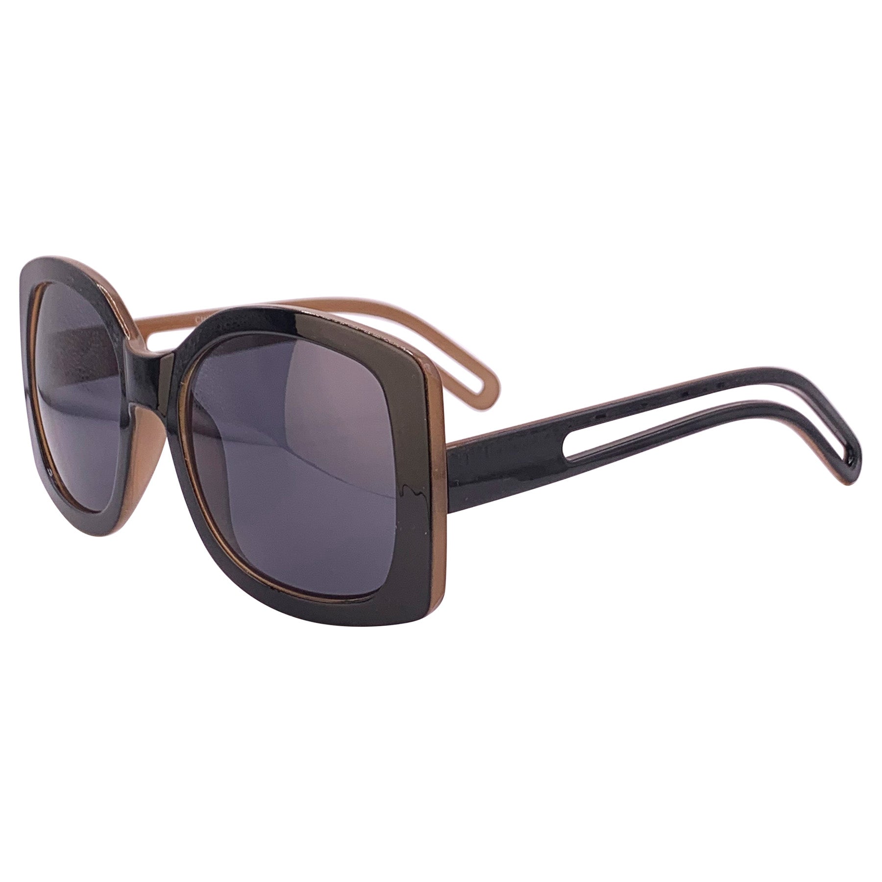 Oversized square boho sunglasses with a black outer frame, smoke lenses, and a brown inner frame, offering a stylish and trendy look for sunny days. Perfect for a chic, laid-back fashion statement.