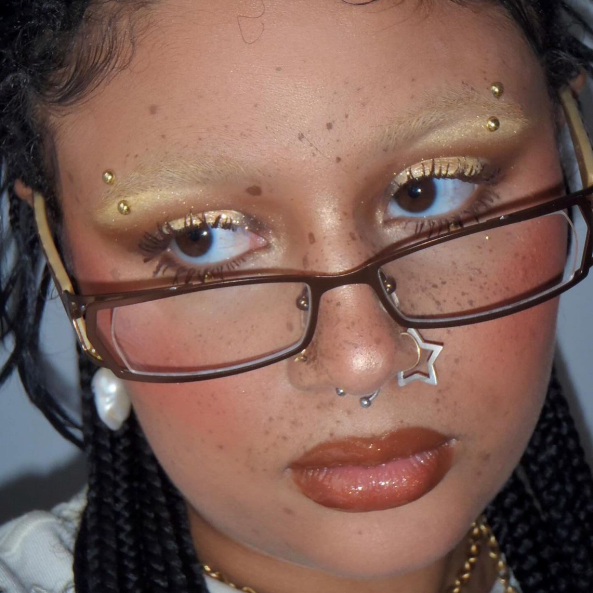 Model with a star nose ring wearing Giant Vintage Safari Clear glasses