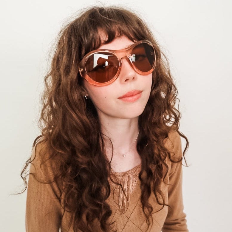 Model wearing BLOOM oversized round sunglasses