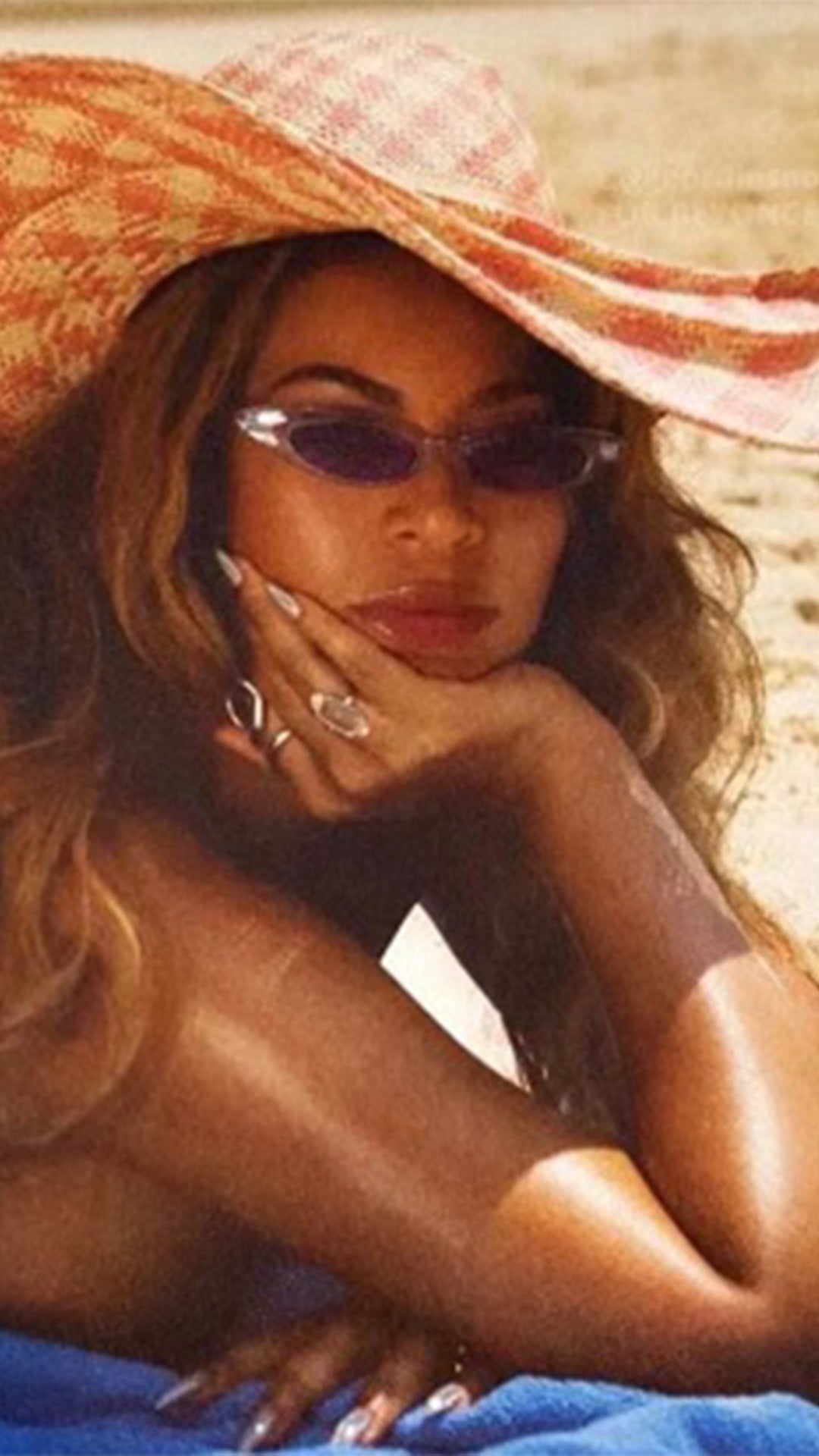 Beyonce on the beach wearing Carolina Cat-Eye Sunglasses by Giant Vintage