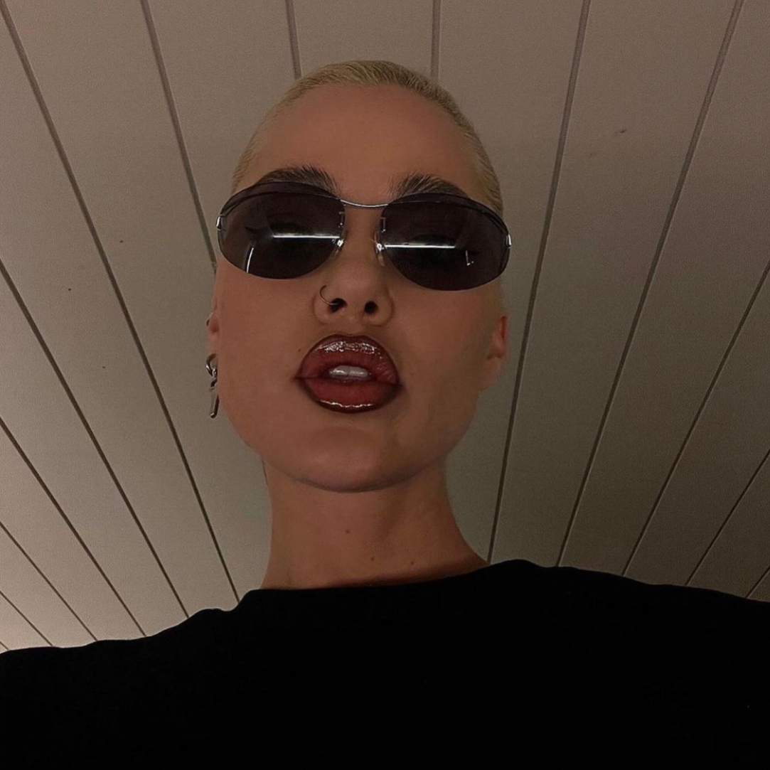 model  with hair slicked back in deleon rimless 90s sunglasses